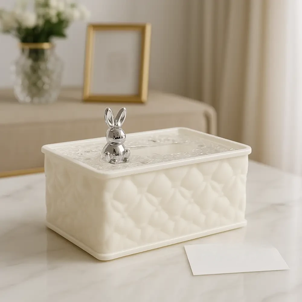 Decorative box with a rabbit figurine on a marble surface