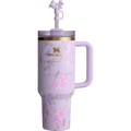 Pink floral Stanley tumbler with handle and straw on a white background