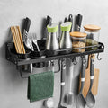 Wall-mounted kitchen organizer with utensils and containers on a gray wall.