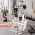 Makeup organizer with various cosmetic items on a table.