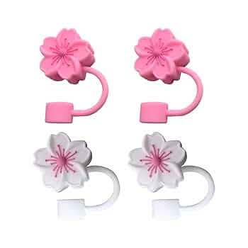 Two pairs of pink and white floral hair ties on a white background