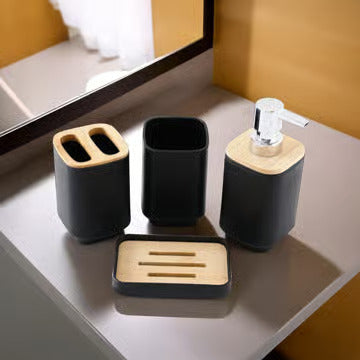 Bathroom accessories set on a counter with black and wooden elements.