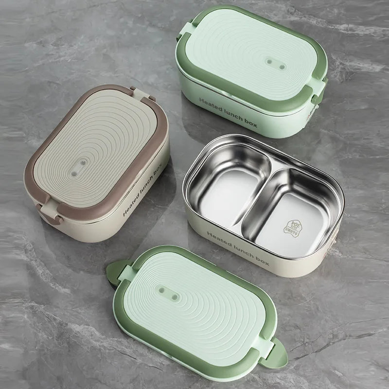 Set of three lunch boxes with different designs on a gray surface