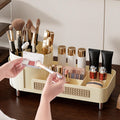Makeup organizer with various cosmetic items on a wooden surface