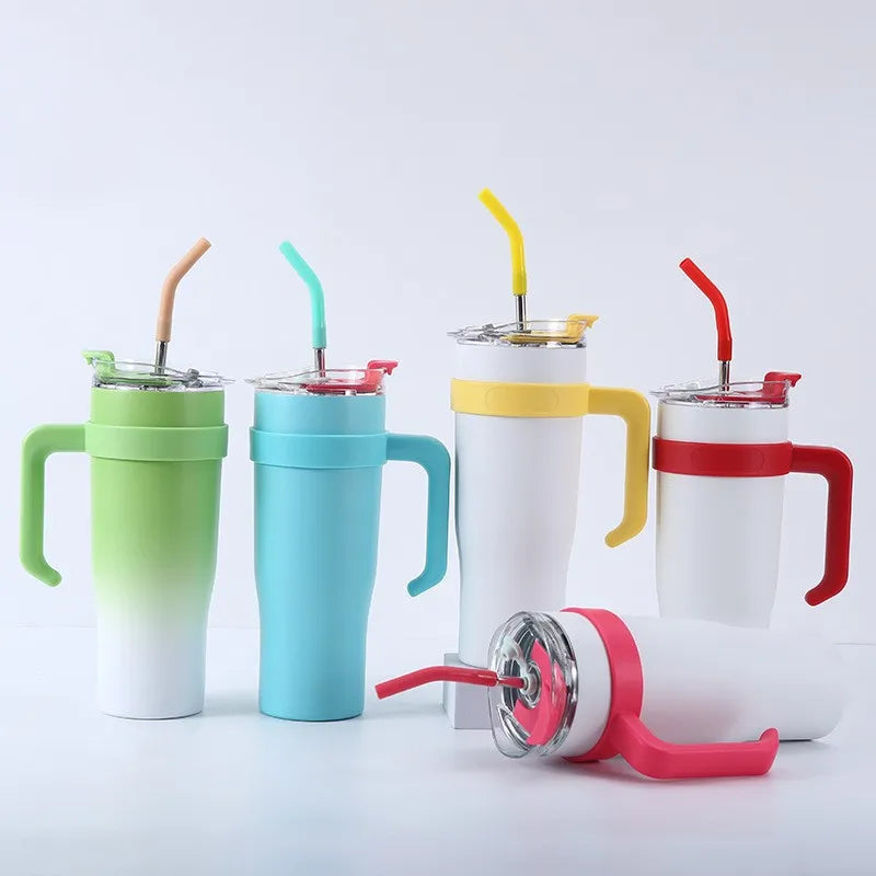 Set of colorful tumblers with handles and straws on a white background