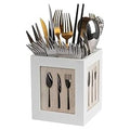 White cube-shaped cutlery holder with silverware on a white background