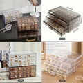 Clear jewelry organizer with multiple drawers displaying jewelry on a table.
