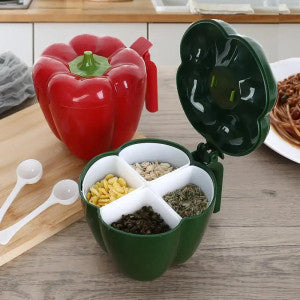 Green pepper-shaped container with compartments on a wooden surface
