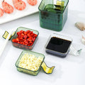 Set of glass condiment containers with food on a white surface