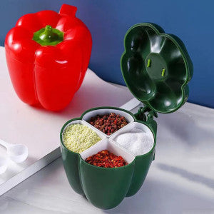 Green pepper-shaped container with compartments filled with spices on a white surface.