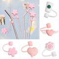 Collage of pink and white accessories including straws, earbuds, and phone case on a light blue background.