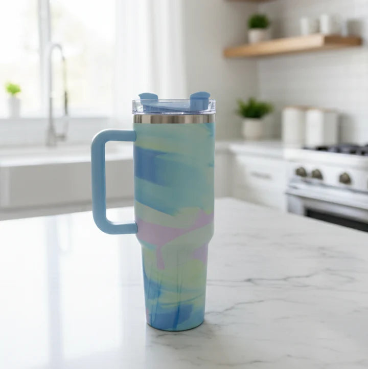 Colorful tumbler with a handle on a kitchen counter