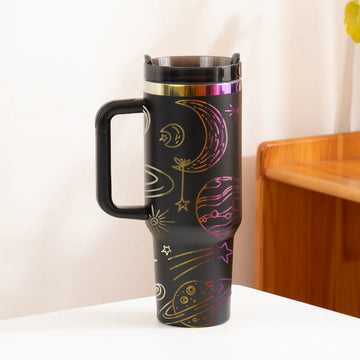 Travel mug with space-themed design on a white surface