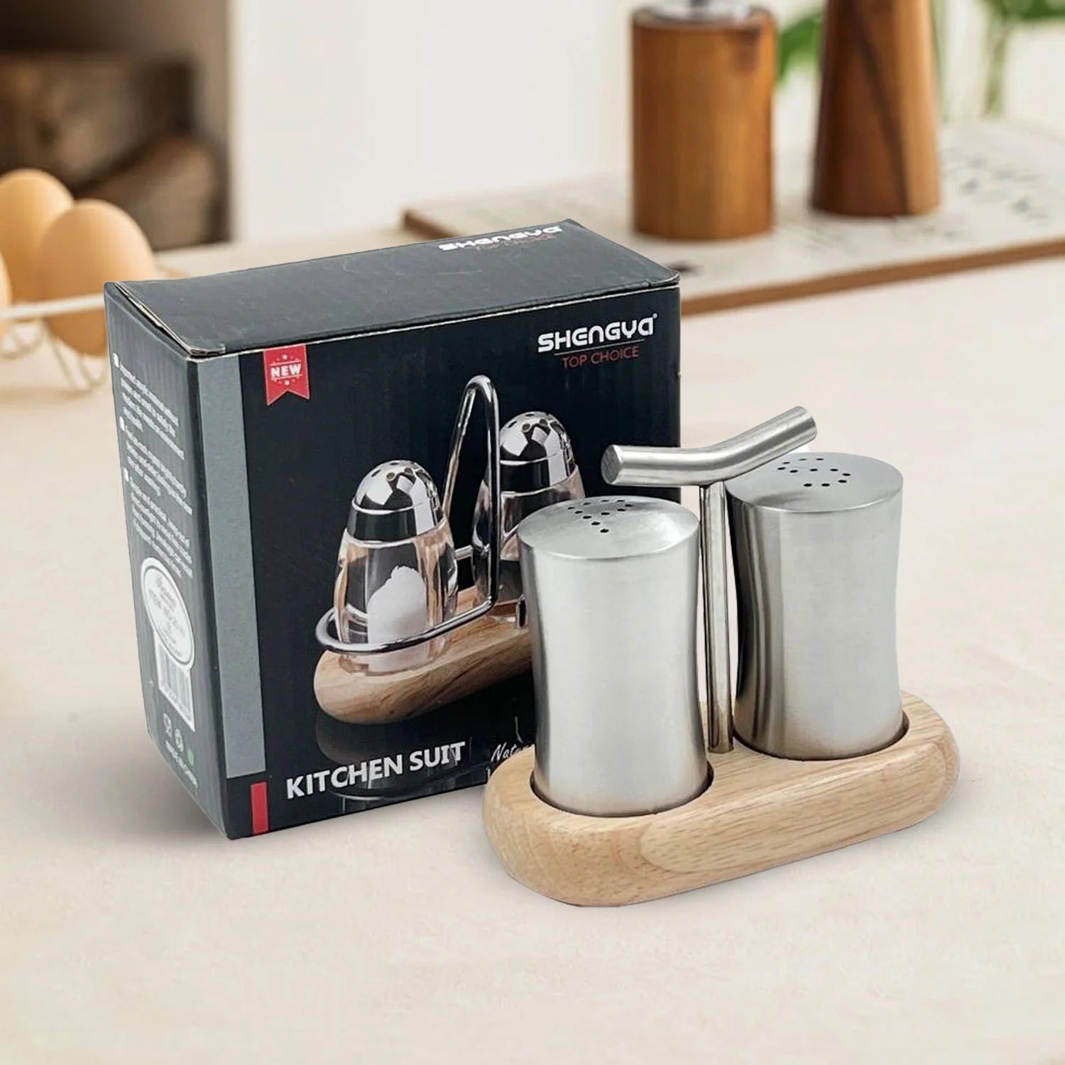 Stainless steel kitchen set with wooden stand and Shengva packaging on a neutral background